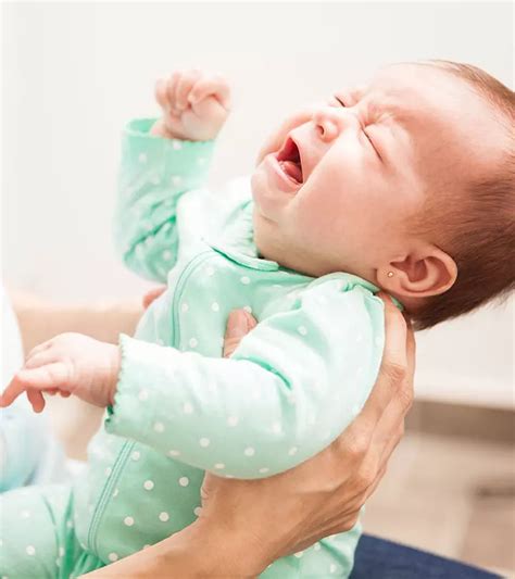 Newborn arching back during feeding