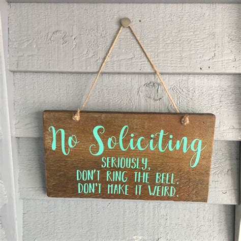 A no soliciting sign with a humorous message