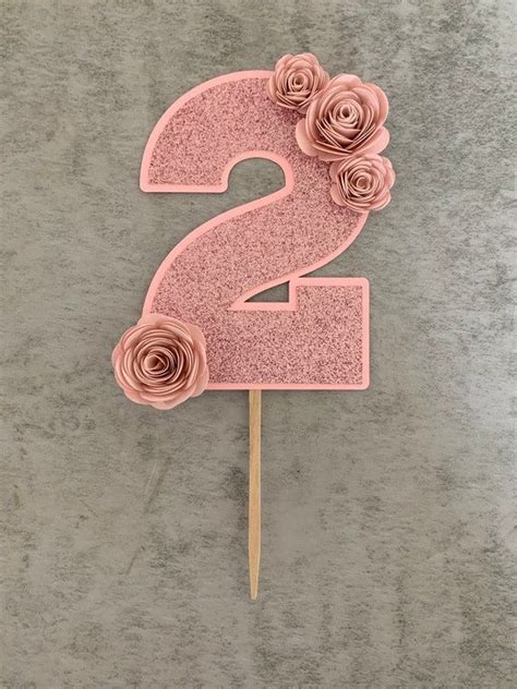 Using a number 2 cake topper is a simple way to create a number 2 cupcake cake template