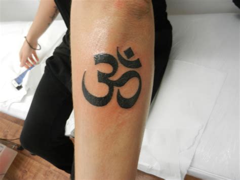 Om symbol tattoo for spiritual growth