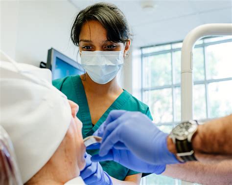 Oral surgeon performing surgery