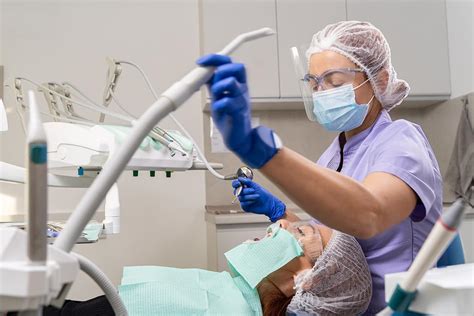 Oral surgeon in scrubs