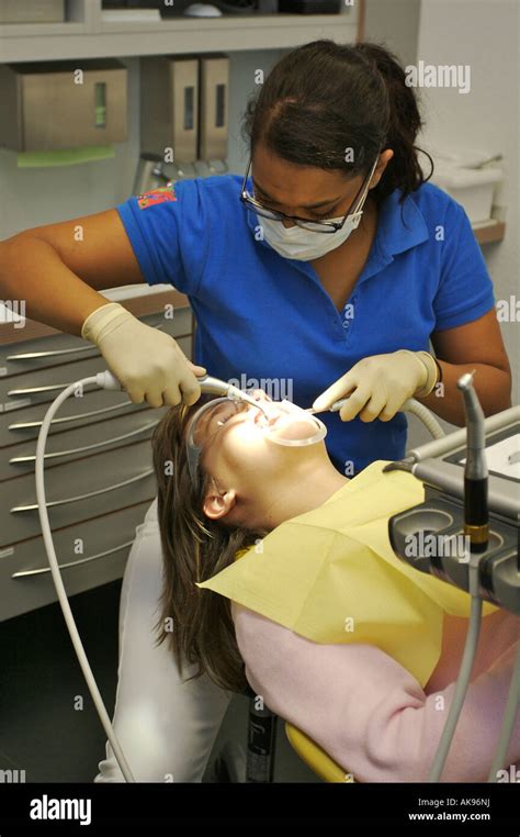 Orthodontist Examining a Patient