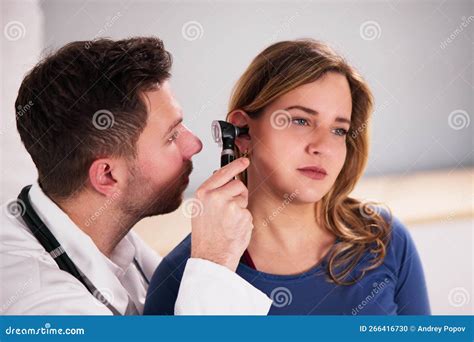 Otolaryngologist examining a patient