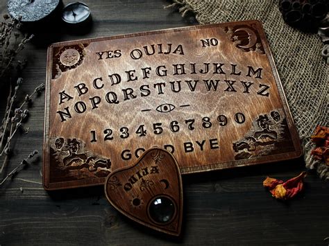 A group of people using a Ouija board