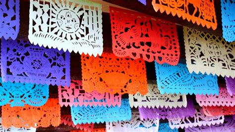 Papel picado hanging in a festive setting