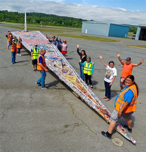 A person attempting to break the record for the longest distance paper plane flight