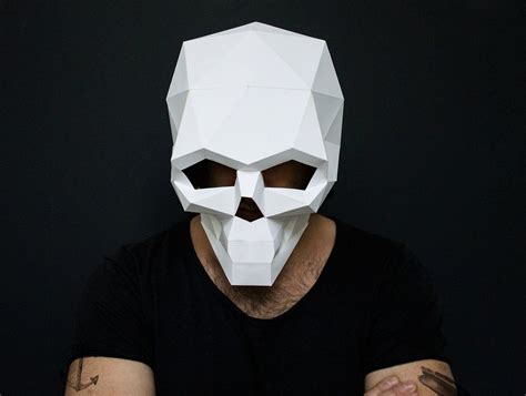 Variety of 3D paper skull designs, showcasing different colors and themes.