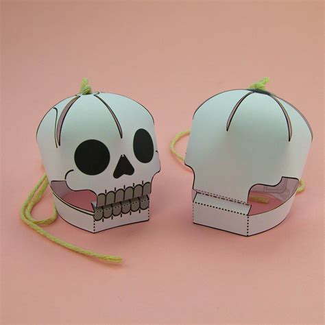 Creative ideas for 3D paper skulls, ranging from decorative pieces to educational tools.