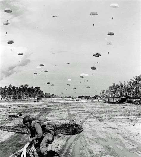 A paratrooper landing safely on the ground