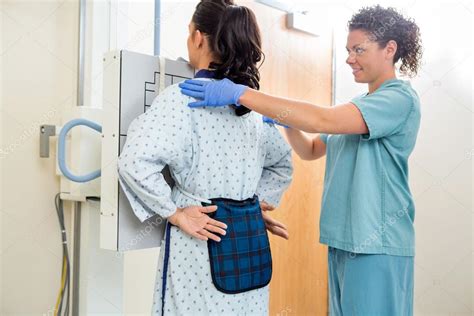 Cardiovascular Technician preparing patient for test