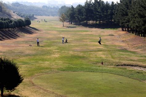 A golfer navigating a challenging Persian golf course