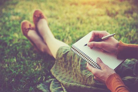 Person reflected in nature while journaling