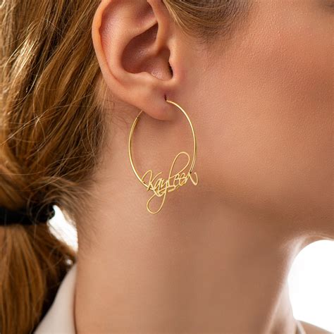 Personalized earrings made using HTVRont sublimation earring template