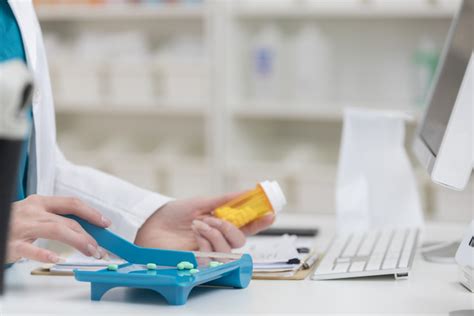 Pharmacy Technician Counting Pills