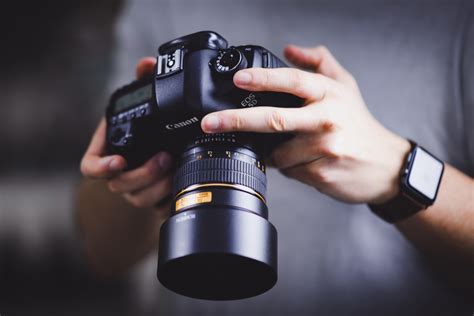 Photographer mentoring an apprentice