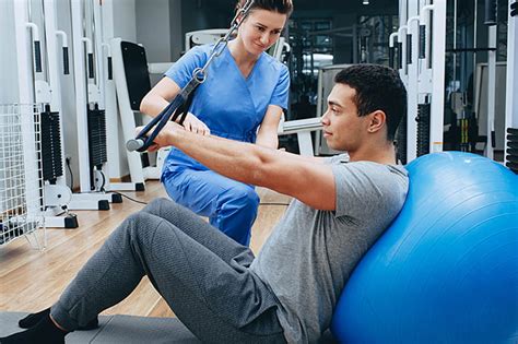 Physical Medicine Specialist working with a patient