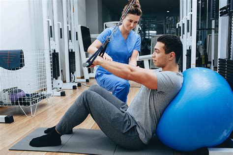 Physical Therapy Assistant working with a patient