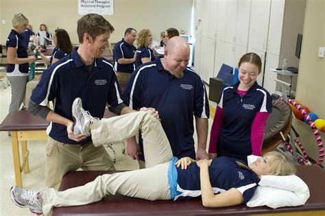 Physical therapy assistant ensuring patient safety