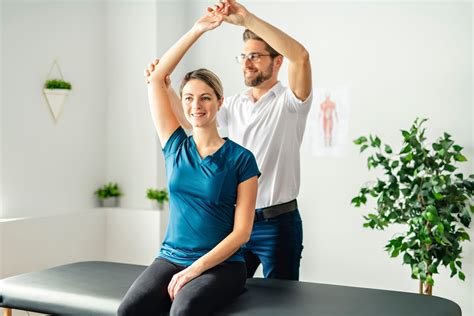 Physical therapy assistant maintaining equipment and supplies