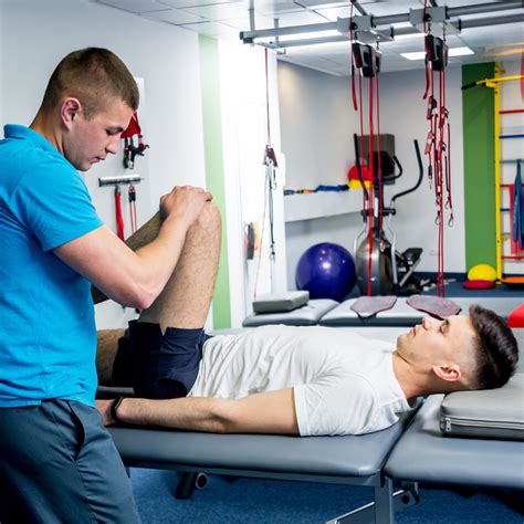 Physical therapist working with a soldier on functional training