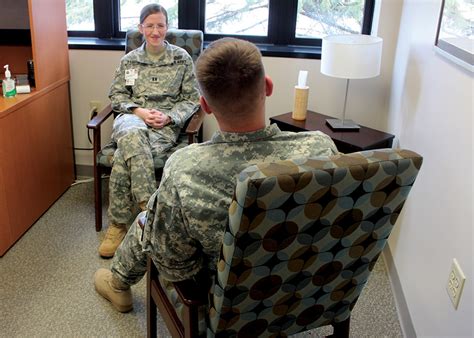 Physical therapist working with a soldier on mental health support