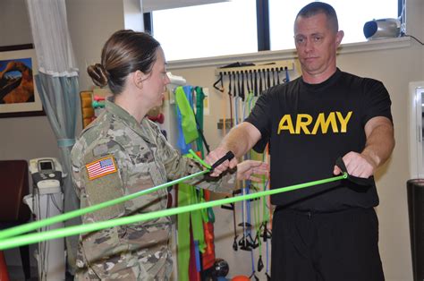 Physical therapist working with a soldier