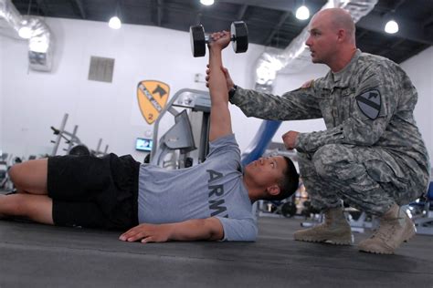 Physical therapist working with a soldier in a rehabilitation setting