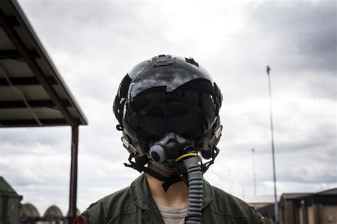 Pilot helmet with emergency beacon