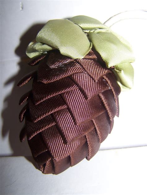 Pinecone and ribbon ornaments on a Christmas tree