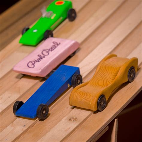 Pinewood Derby cars on a track