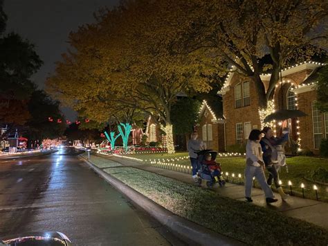 A residential street in Plano decorated with Christmas lights