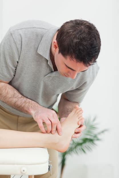 A podiatrist examining a patient's foot