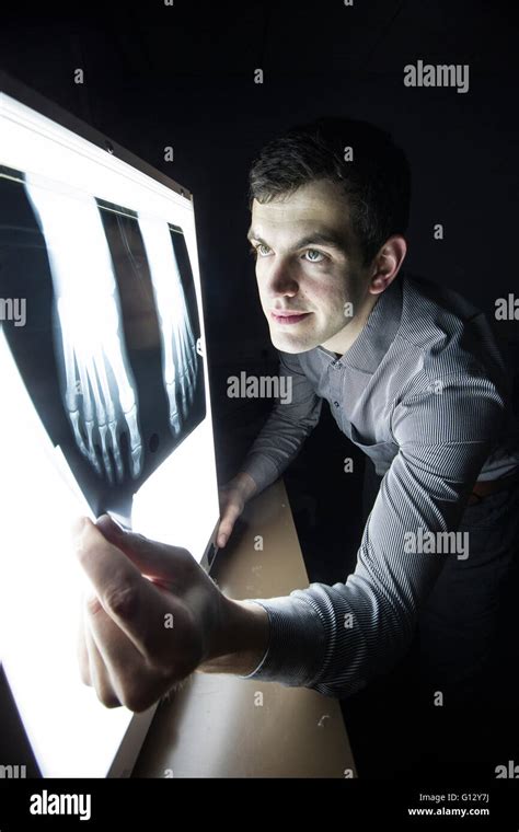 A podiatrist examining an X-ray