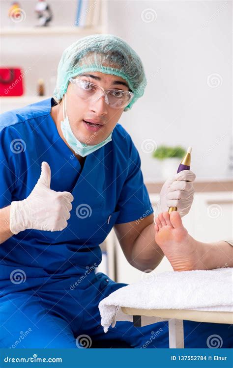 A podiatrist treating a patient