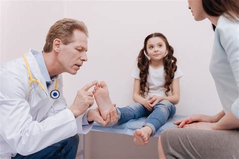 A podiatrist working with a child