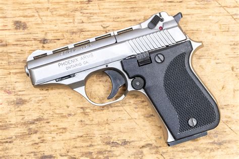 Police officer loading pistol with ammunition