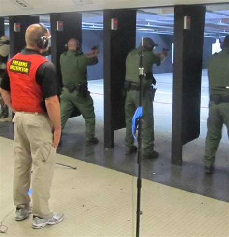 Police Officer Participating in Pistol Training Exercise