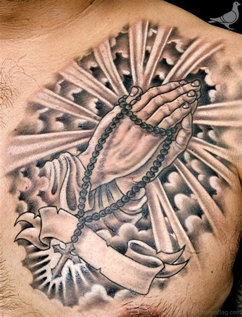 Praying hands tattoo on chest