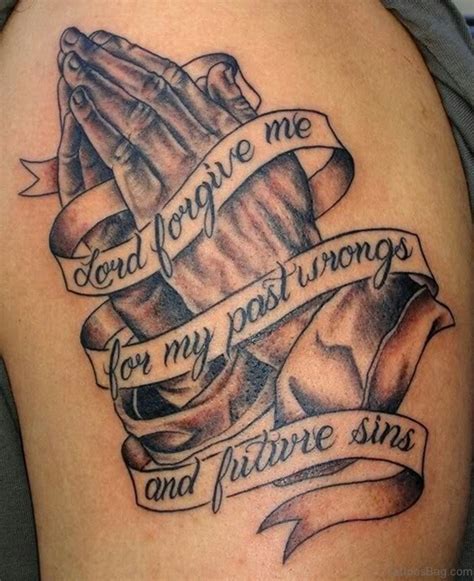 Praying hands tattoo on shoulder