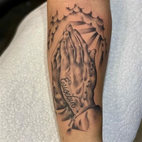 Praying hands tattoo placement