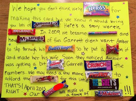 Pregnancy announcement idea featuring a candy bar and a sign