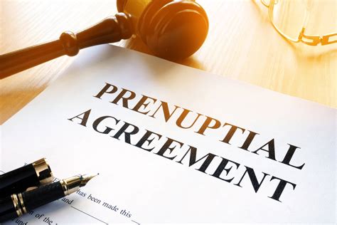 Couple meeting with a lawyer to discuss prenuptial agreement