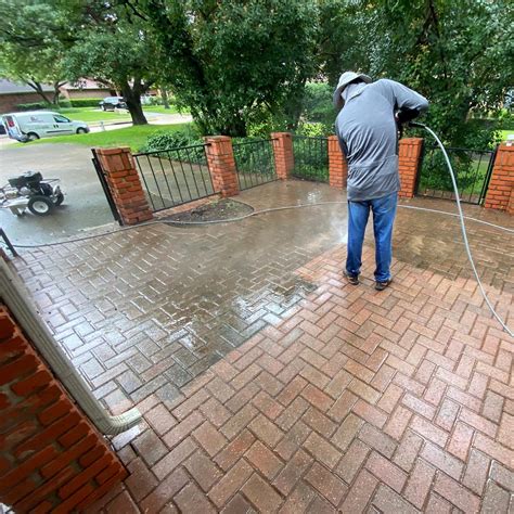 Pressure washing a driveway