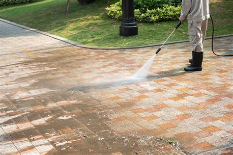 Pressure washing a sidewalk