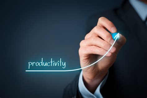 Image of a person working on a laptop with a cup of coffee