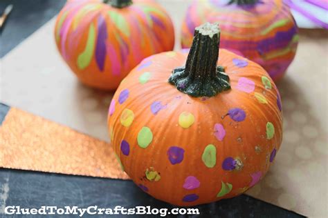 A person carving a pumpkin