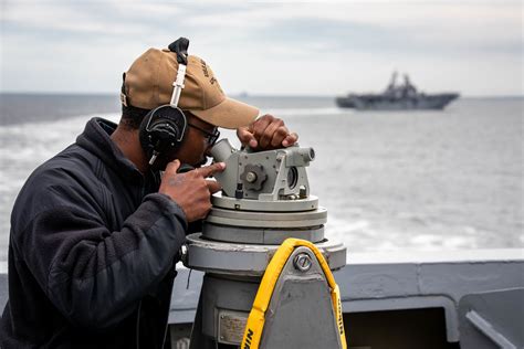 Quartermaster on a ship navigating through rough seas