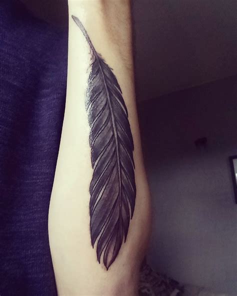 Raven feather tattoo design