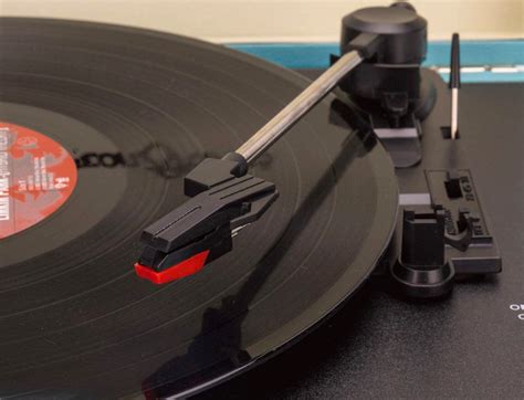 A close-up of a record player's needle tracking a vinyl record